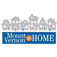 Mt Vernon at HomeMt Vernon at Home logo in color. Icon of houses lined up with icon of people standing in the doors of the houses in various colors. Icon atop words of organization with blue background.