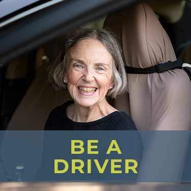 Be a volunteer driver to help aging adults with transportation. Smiling volunteer driver, ready to provide a ride to an aging adult who needs help getting around. She's happy because transportation for seniors is now solved!